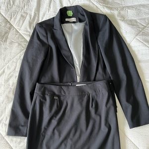 Calvin Klein suit pieces in navy blue. Jacket size 10; skirt size 4.